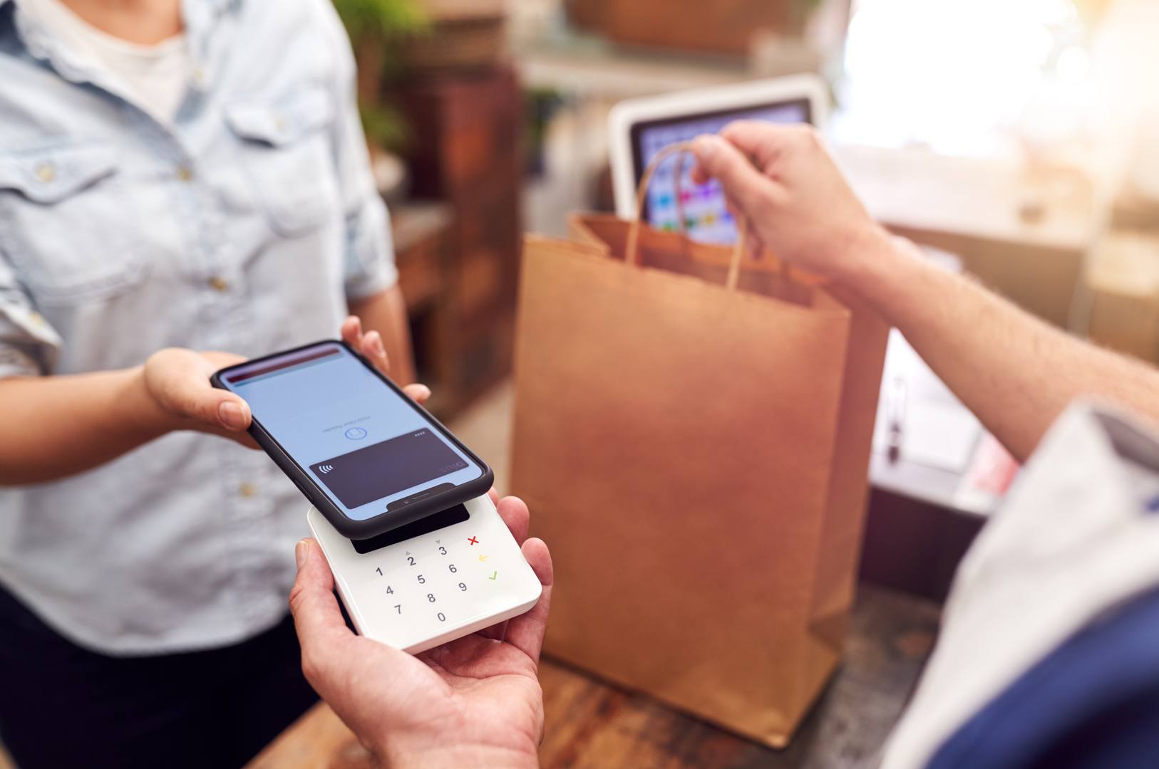 header image of payment using cell phone